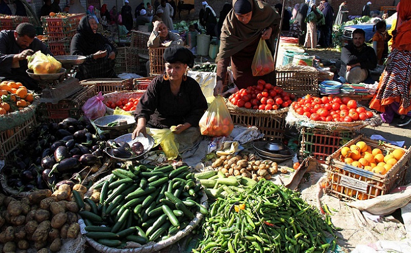 woman selling vegetables in a market