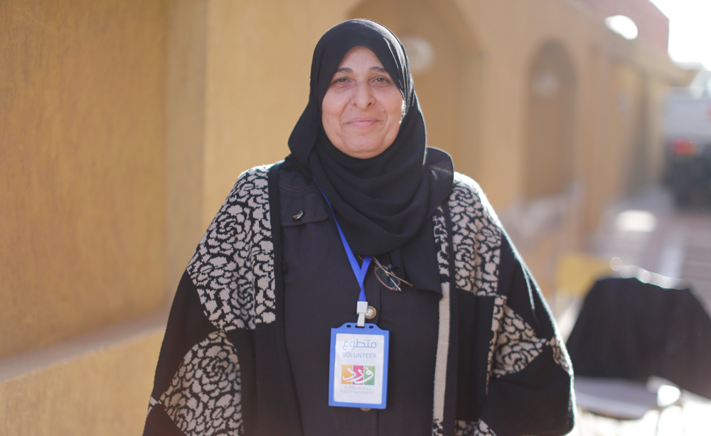The 55-Year-Old Syrian Refugee Defeating Stereotypes by Volunteering at the Same NGO that Helps Her